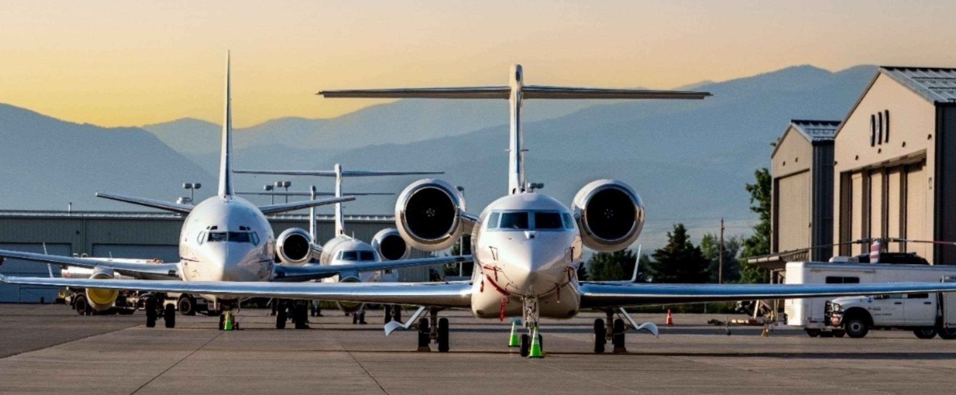 An image of airplanes lined up on a runway.