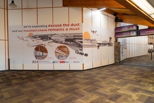 Temporary construction barrier wall - baggage claim PH0  12/20/2024