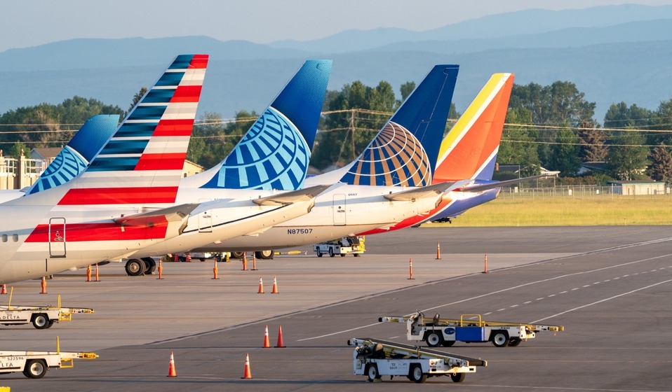airline tails parked at gates, close up 